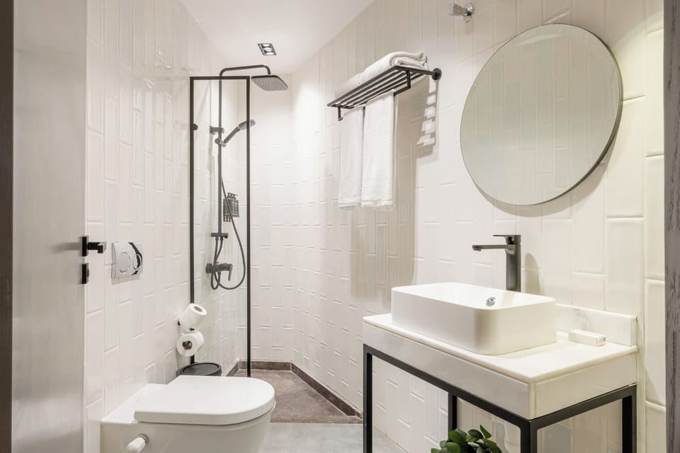 Economy Studio, Balcony | Bathroom | Shower, slippers, towels, soap