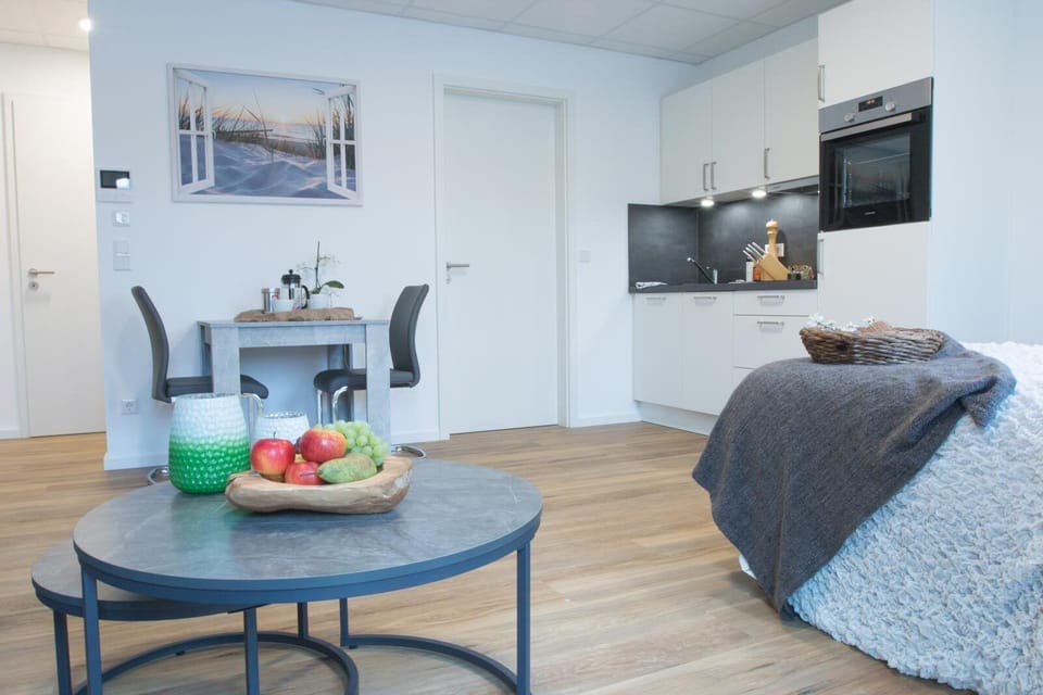 Comfort Apartment, Resort View | Living area | TV