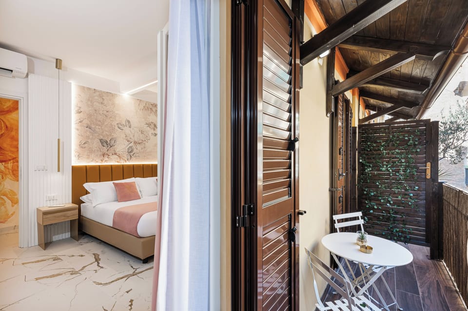 Deluxe Double Room, Balcony, Courtyard View | In-room safe, desk, laptop workspace, blackout drapes