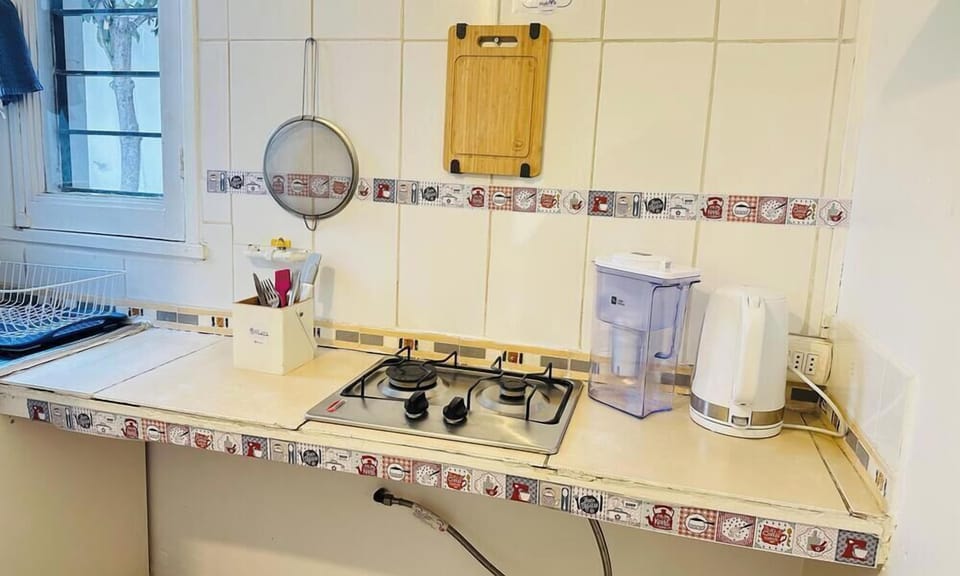 Classic Triple Room, Patio, Courtyard View | Private kitchenette | Microwave