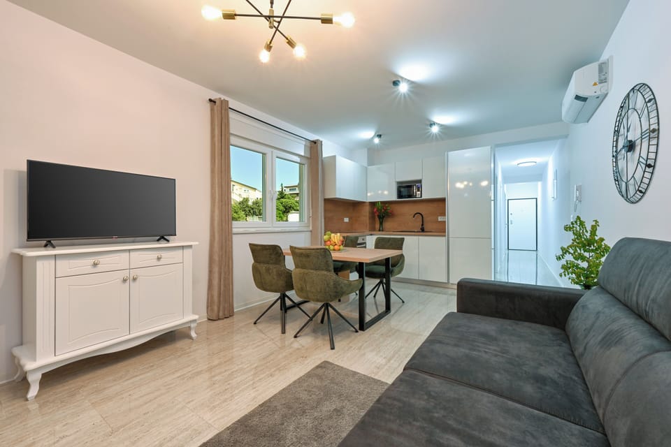 Deluxe Apartment, Balcony, Partial Sea View | Living area | TV