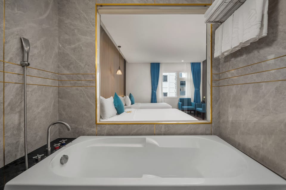 Family Room Cityview with Bathtub | Bathroom | Hair dryer, slippers, bidet, towels