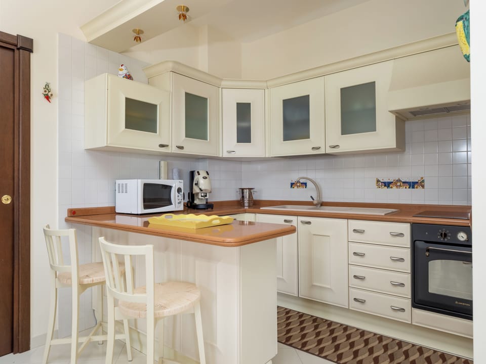 Panoramic Condo, Balcony, Sea View | Private kitchen | Fridge, microwave, oven, stovetop