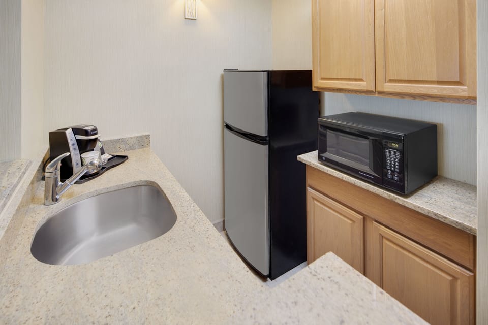 Premium bedding, desk, laptop workspace, iron/ironing board