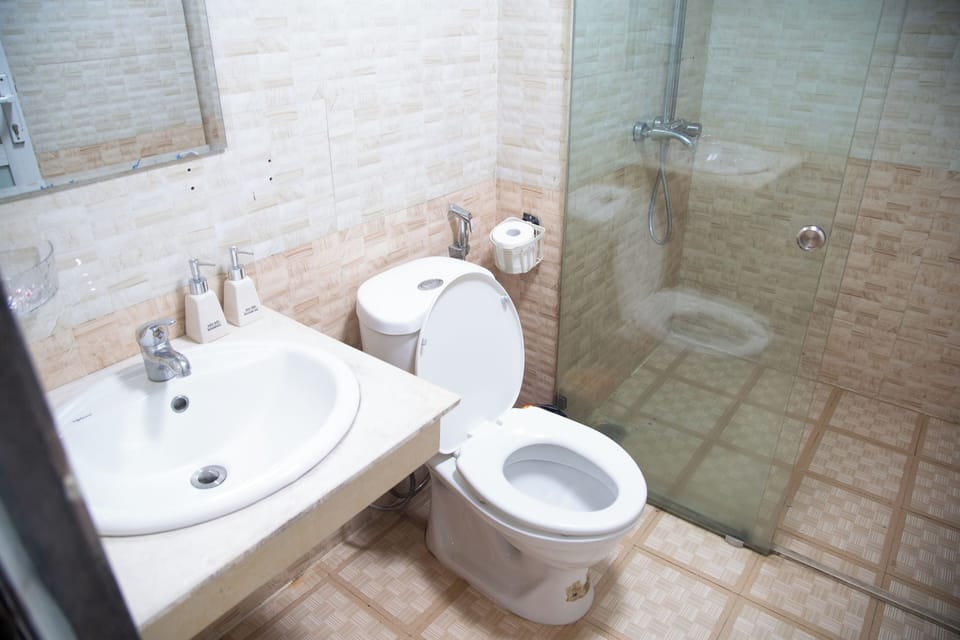 Shower, free toiletries, hair dryer, slippers