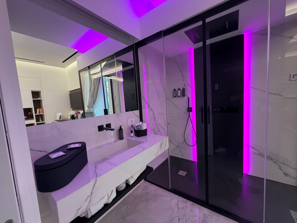 Superior Double Room, Balcony, City View | Bathroom | Shower, hair dryer, bathrobes, slippers