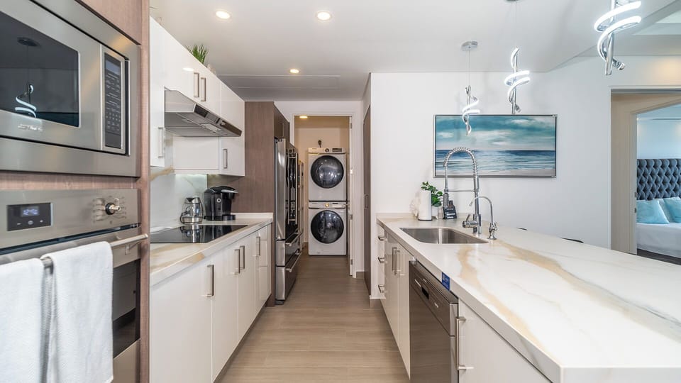 Condo, Multiple Beds, Balcony, Ocean View (Encantame Towers Velero 1802) | Laundry