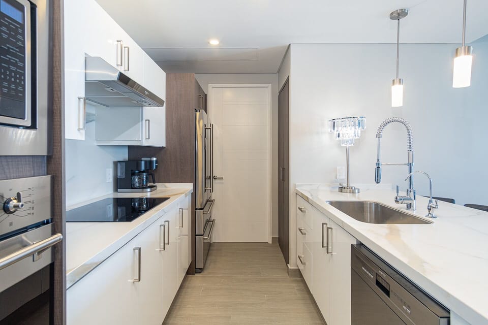 Condo, Multiple Beds, Balcony, Ocean View (Encantame Towers Velero 2204) | Private kitchen | Dining table