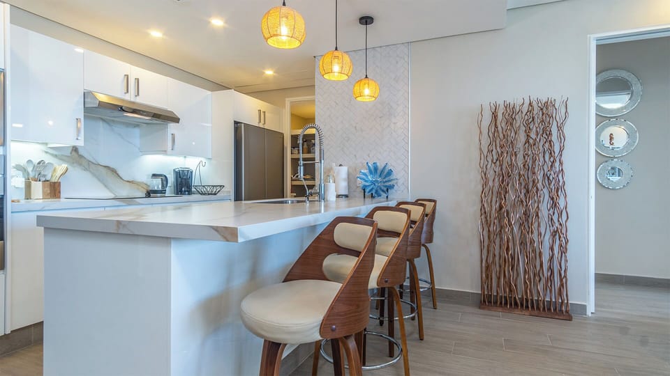 Condo, Multiple Beds, Balcony, Ocean View (Encantame Towers Viento 1404) | Private kitchen | Dining table
