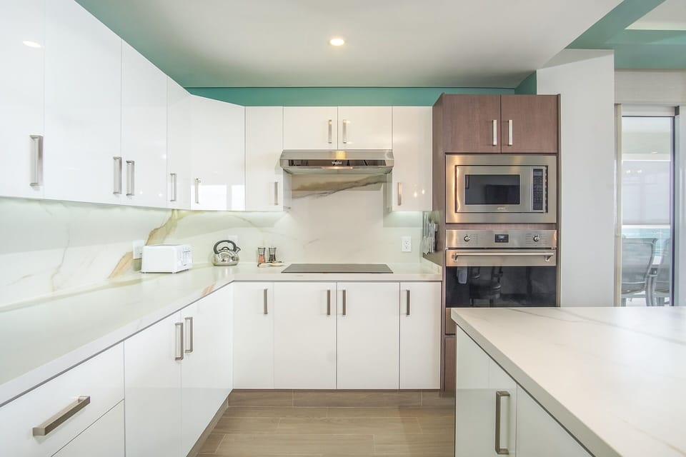 Condo, Multiple Beds, Balcony, Ocean View (Encantame Towers Verano 1001) | Private kitchen | Dining table