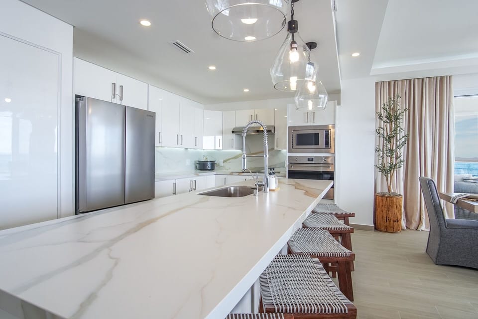 Condo, Multiple Beds, Balcony, Ocean View (Encantame Towers Verano 301) | Private kitchen | Dining table