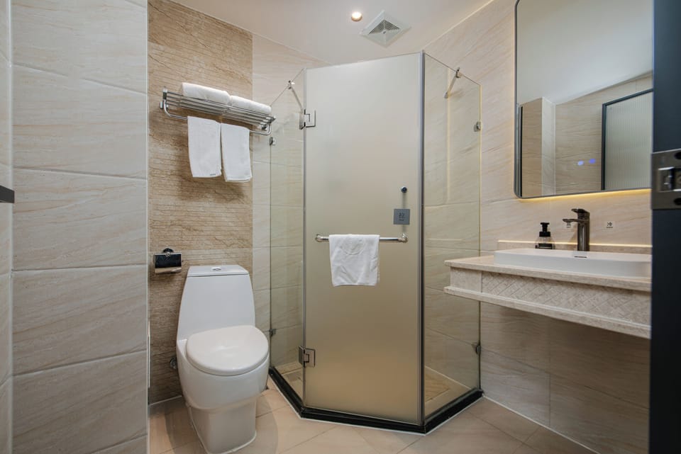Shower, free toiletries, hair dryer, slippers