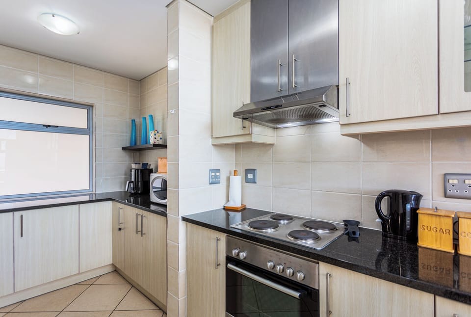 Deluxe Apartment, Balcony, Partial Sea View | Private kitchen | Full-size fridge, microwave, oven, stovetop