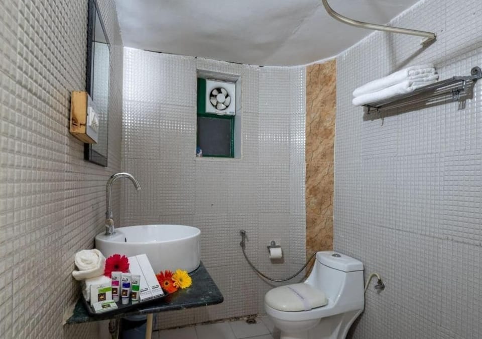 Shower, bathrobes, slippers, towels