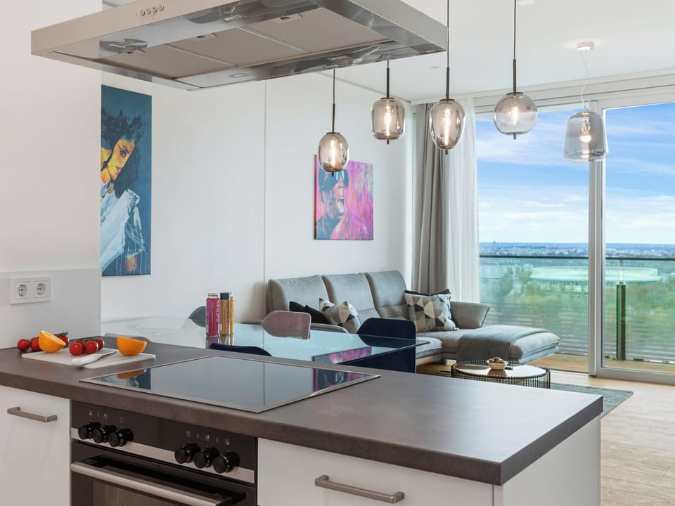 Deluxe Penthouse, 2 Bedrooms, Pool Access, City View | Living area | 60-inch LED TV with digital channels, Netflix, heated floors