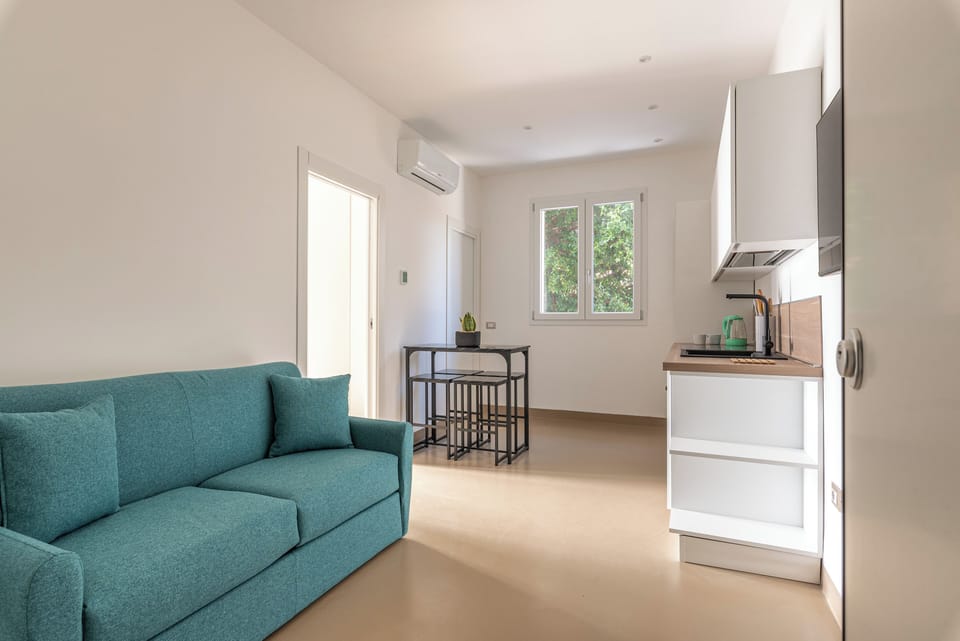 Apartment, 1 Bedroom | Living area | 30-inch TV with satellite channels