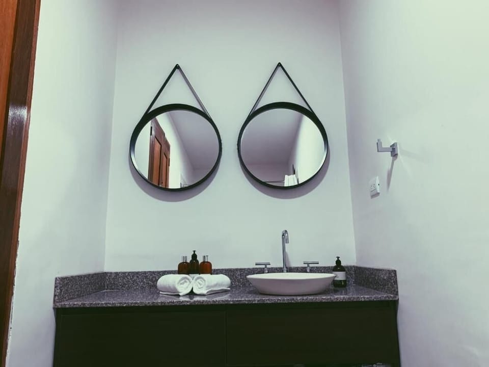 Shower, rainfall showerhead, hair dryer, towels