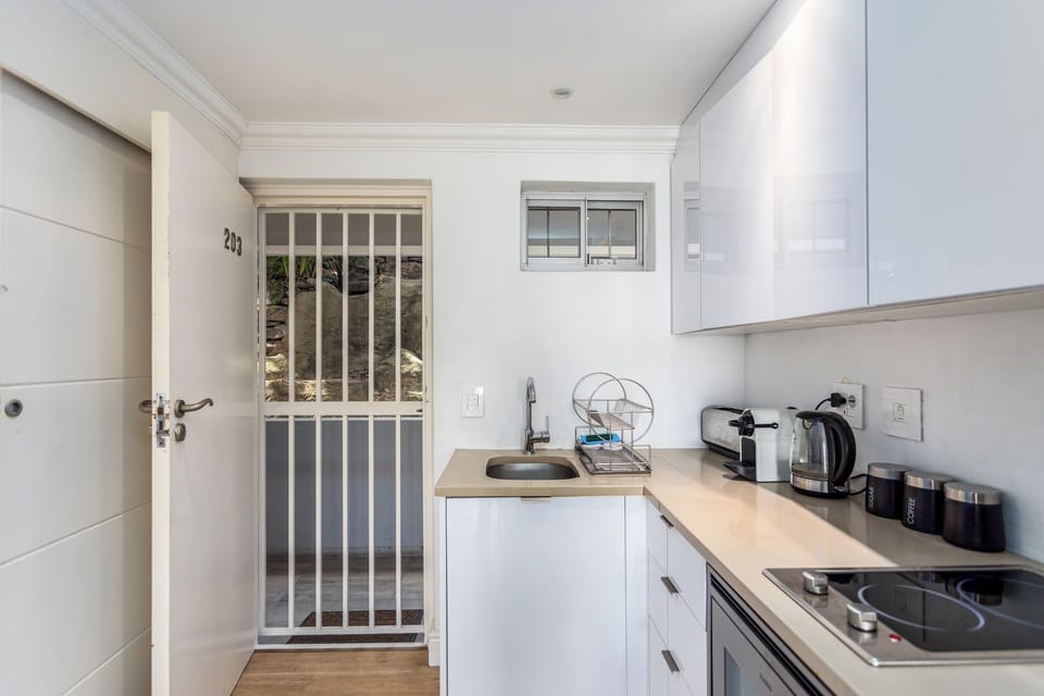 Deluxe Apartment, Balcony, Beach View | Private kitchen | Full-size fridge, microwave, oven, stovetop