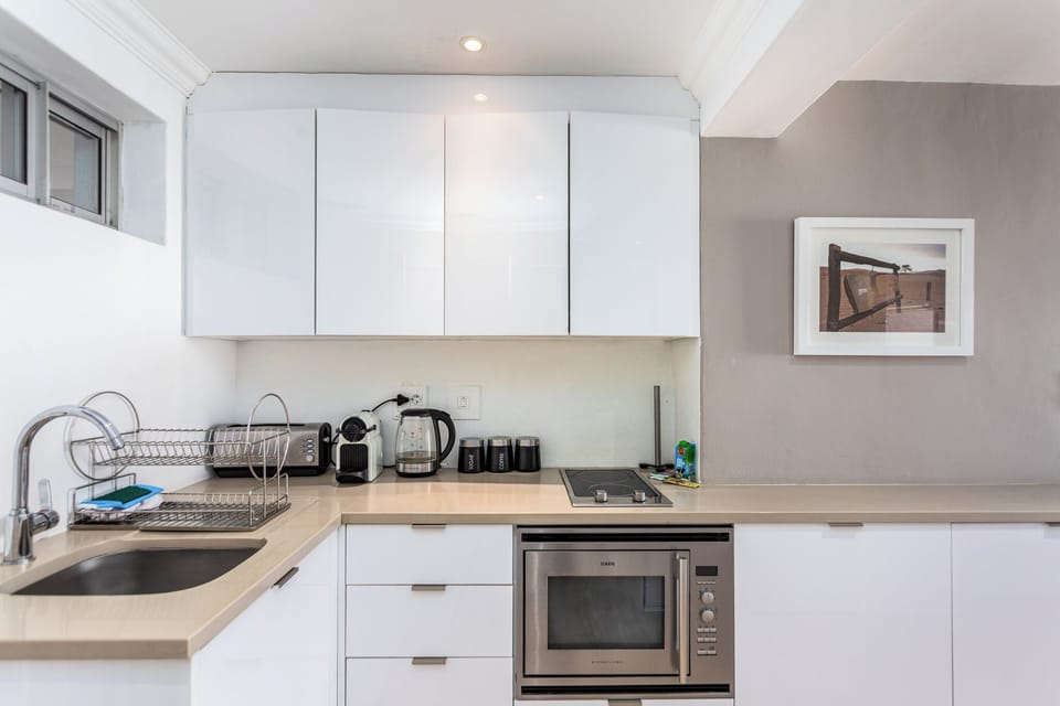 Deluxe Apartment, Balcony, Beach View | Private kitchen | Full-size fridge, microwave, oven, stovetop