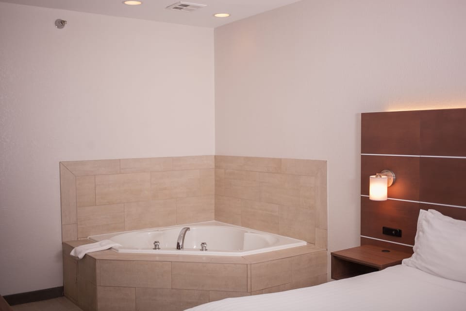 Suite, 1 King Bed with Sofa bed | In-room safe, desk, iron/ironing board, cribs/infant beds