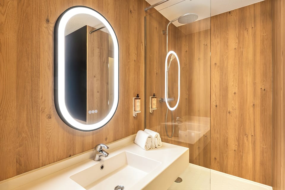 Shower, eco-friendly toiletries, hair dryer, towels