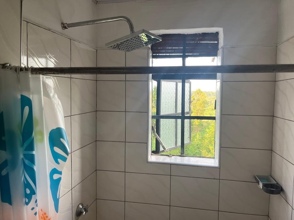 Deluxe Double Room, Garden View | Bathroom | Shower, slippers, towels, soap