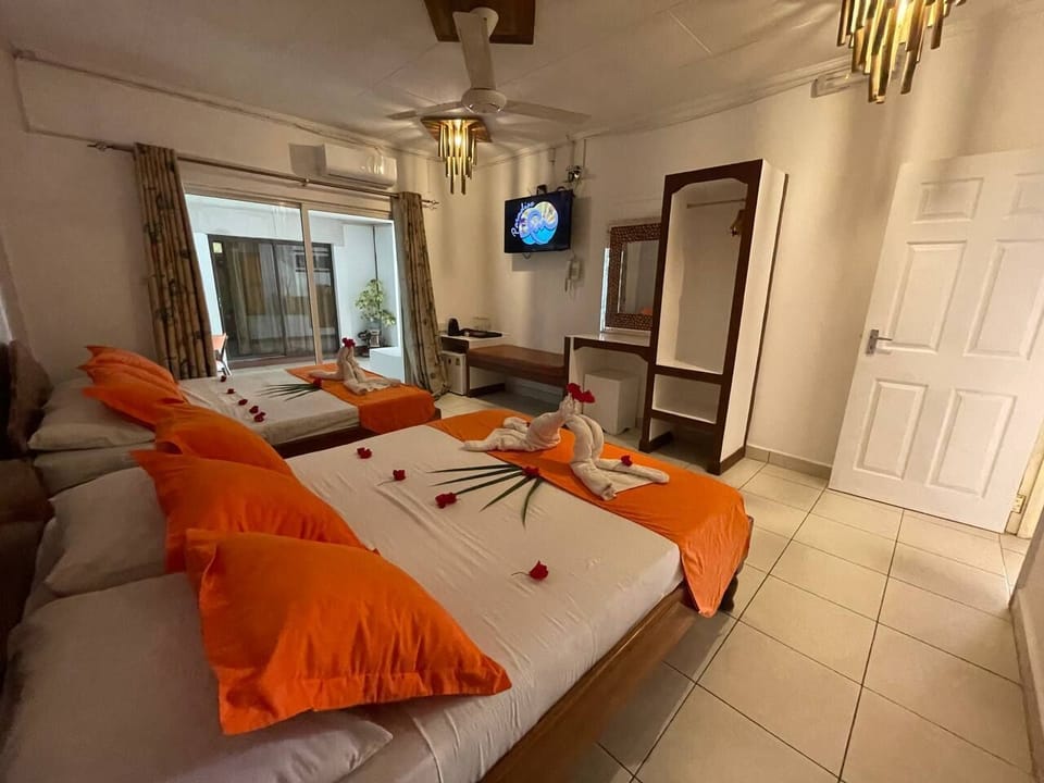 Standard Quadruple Room, 2 Queen Beds | Minibar, in-room safe, desk, WiFi (free)