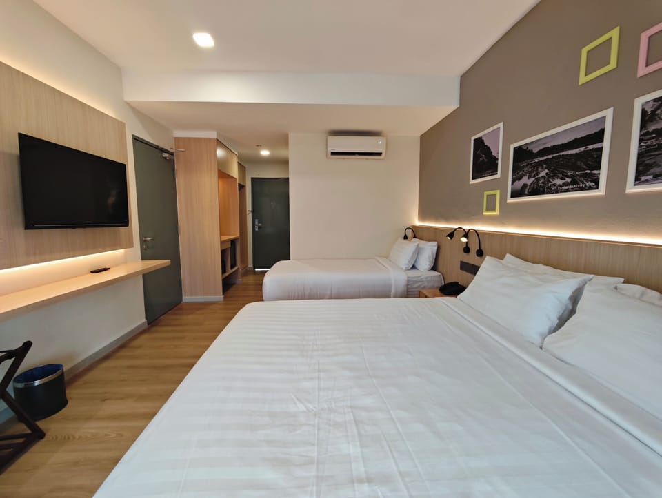 Family Room, Garden View | In-room safe, desk, laptop workspace, blackout drapes