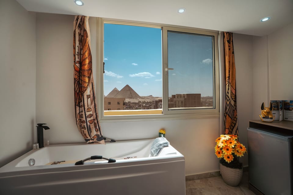 Junior Suite with Jacuzzi -  Panoramic Pyramids View | Egyptian cotton sheets, premium bedding, down comforters, minibar