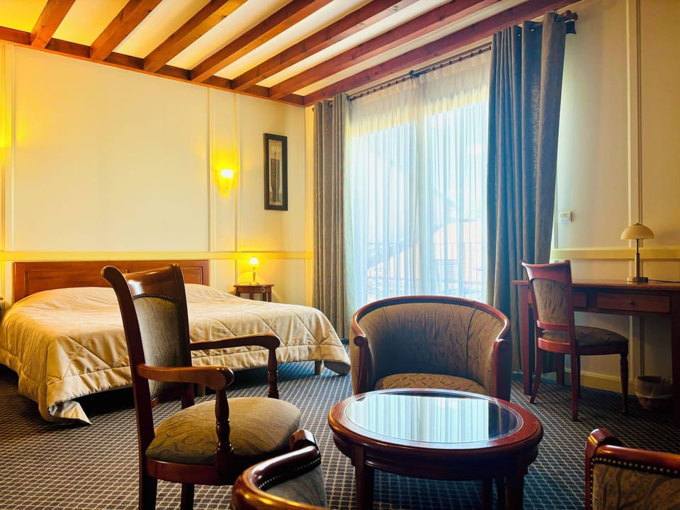 Suite, Balcony, Garden View | In-room safe, blackout drapes, soundproofing, iron/ironing board