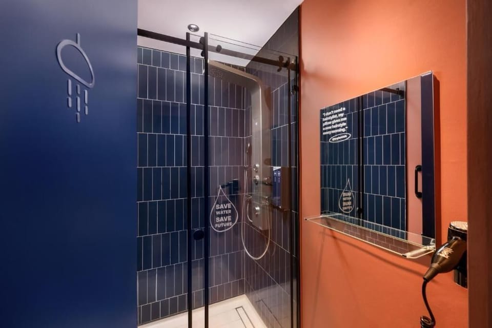 Shower, hair dryer, slippers, towels