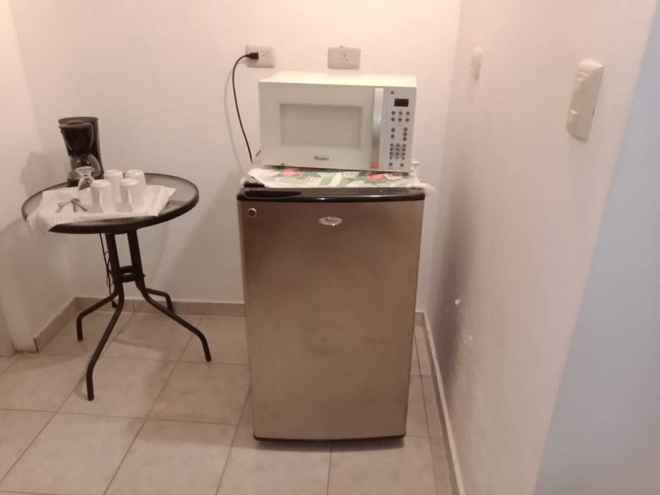 Basic Single Room, 1 Queen Bed | Private kitchen | Fridge, coffee/tea maker, dining tables