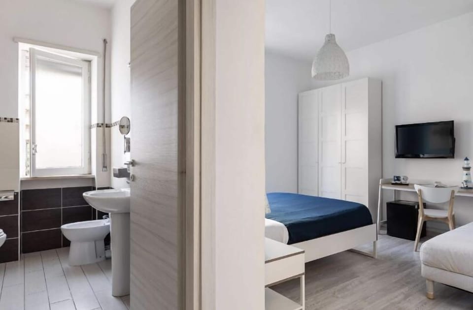 Standard Triple Room | Blackout drapes, soundproofing, iron/ironing board, free WiFi