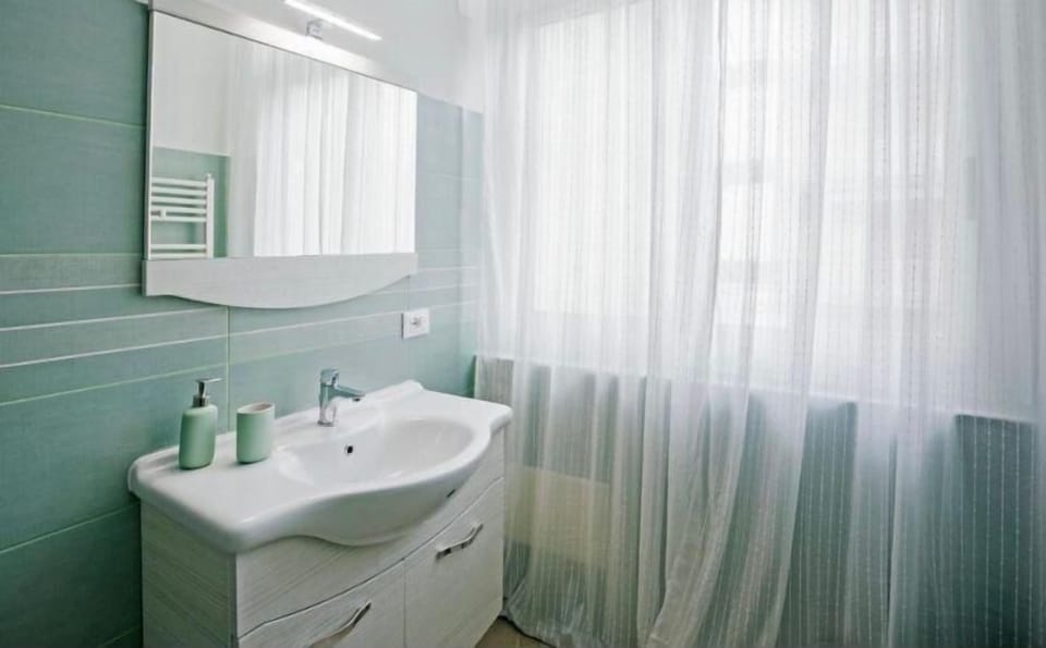 Deluxe Double Room, Balcony, Courtyard View | Bathroom | Bathrobes