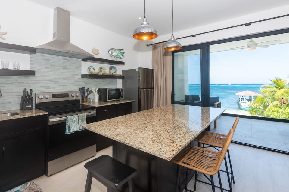 Condo, 5 Bedrooms | Private kitchen | Fridge, oven, coffee/tea maker, toaster