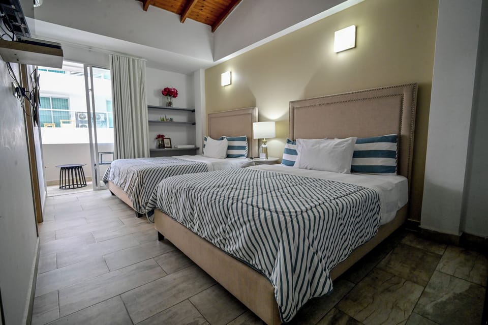 Standard Double Room, 2 Queen Beds, Balcony, City View | Down comforters, minibar, individually decorated, free WiFi