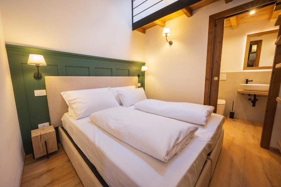 Deluxe Triple Room, Mountain View | Minibar, in-room safe, blackout drapes, free WiFi