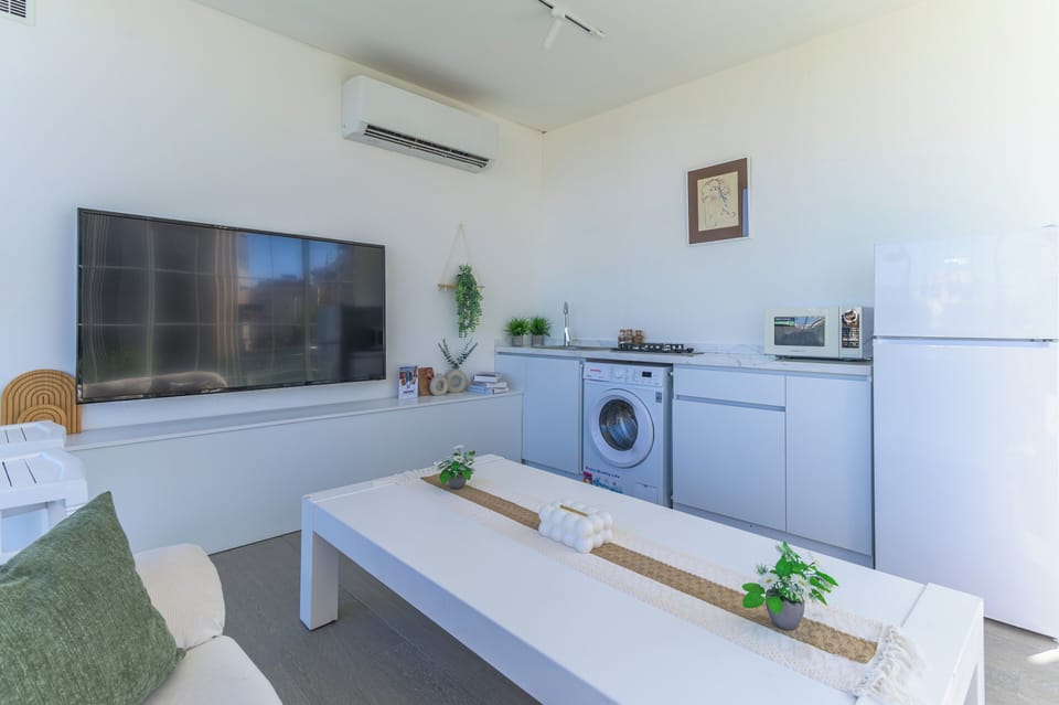 Apartment, 2 Bedrooms, Kitchenette, City View | Living room | 65-inch Smart TV with cable channels, streaming services