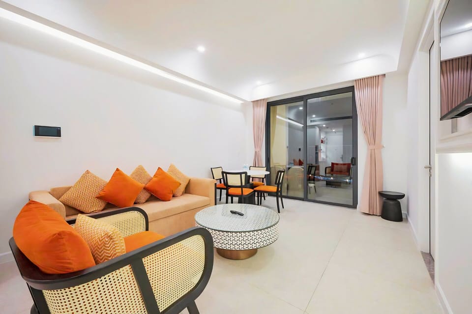 Family Quadruple Room, 2 Bedrooms, Pool Access, City View | Living area | 55-inch Smart TV with cable channels