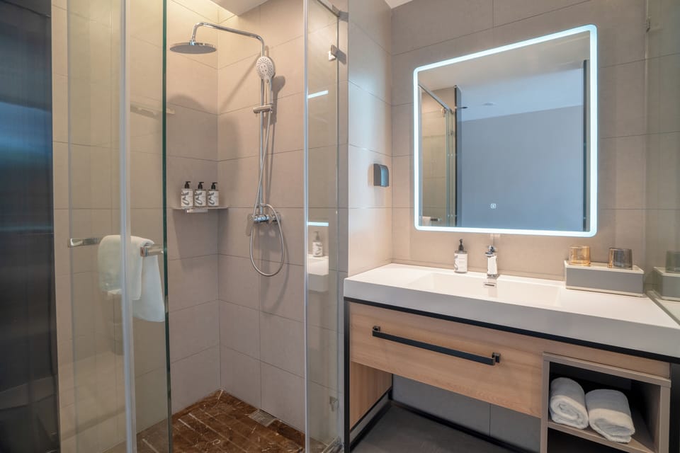 Shower, free toiletries, hair dryer, slippers