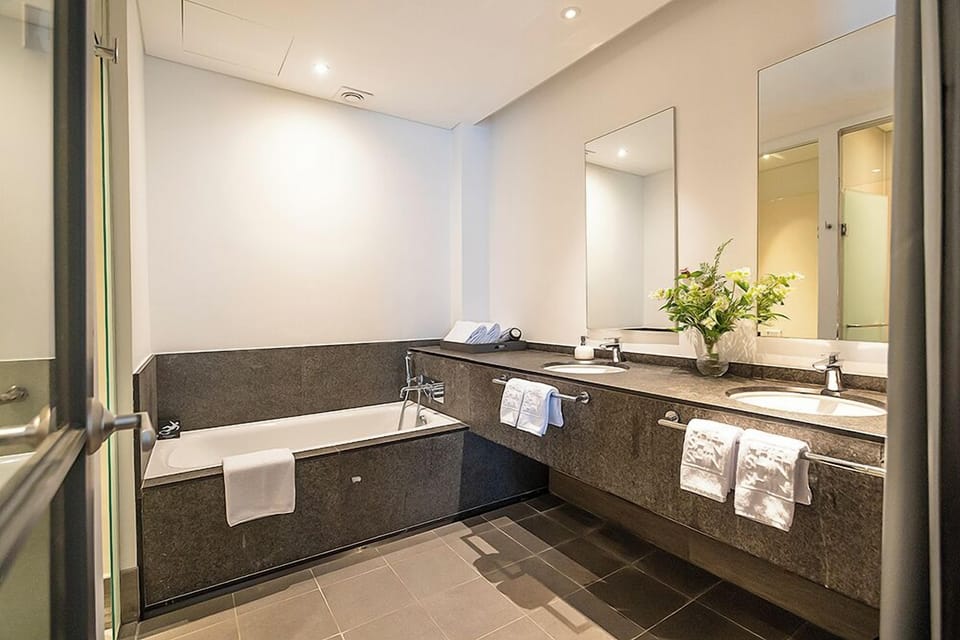 Deluxe Quadruple Room | Bathroom | Hair dryer, slippers, bidet, towels