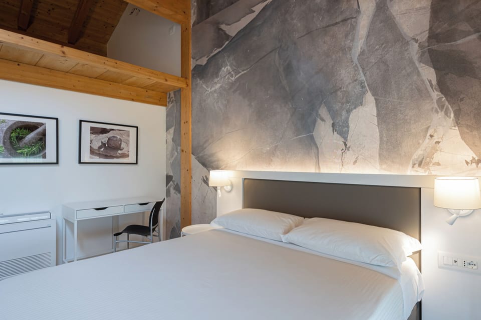 Superior Double Room, Private Bathroom | In-room safe, desk, laptop workspace, blackout drapes