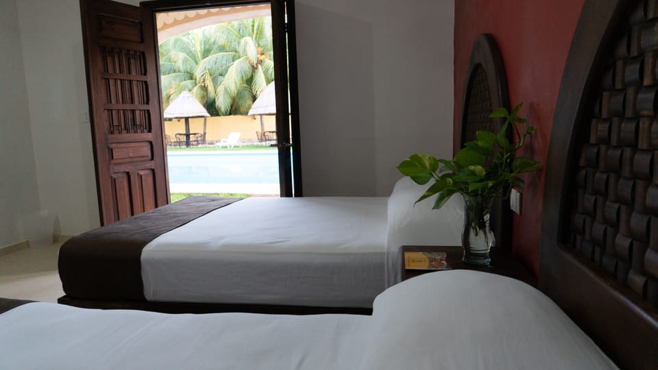 Deluxe Room, 1 King Bed, Garden View | Individually furnished, free WiFi, bed sheets