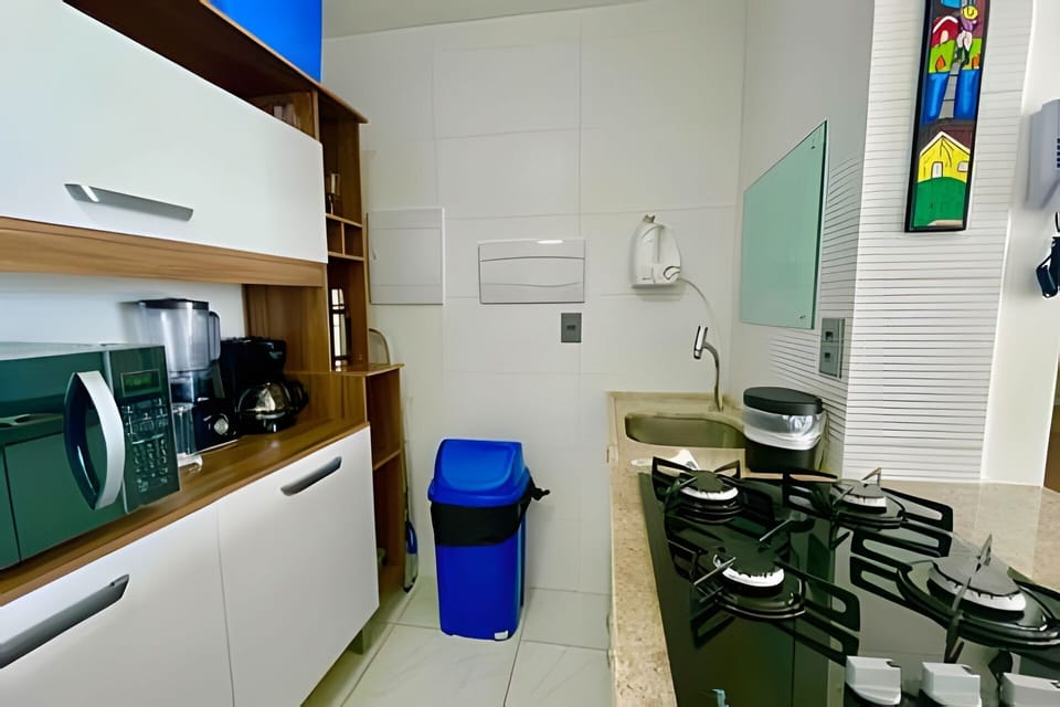 Standard Apartment | Private kitchen | Microwave, stovetop, cookware/dishes/utensils