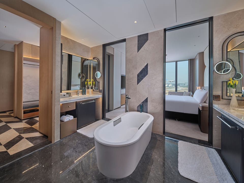 King Deluxe Suite | Bathroom | Rainfall showerhead, free toiletries, hair dryer, slippers