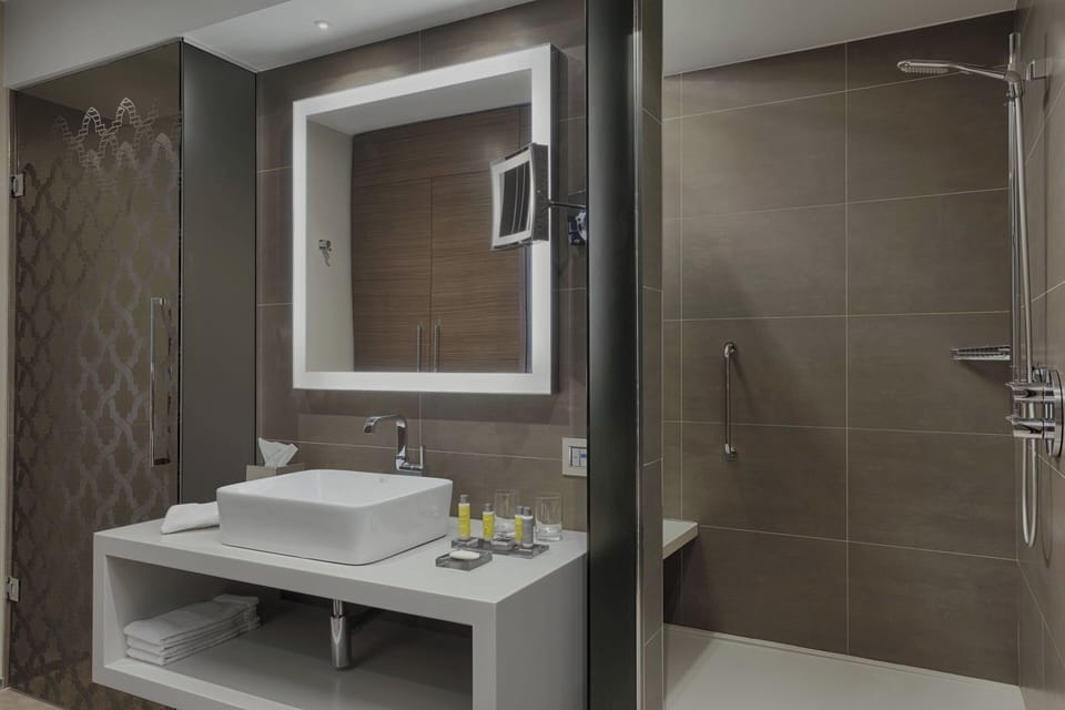 Combined shower/tub, designer toiletries, hair dryer, bathrobes