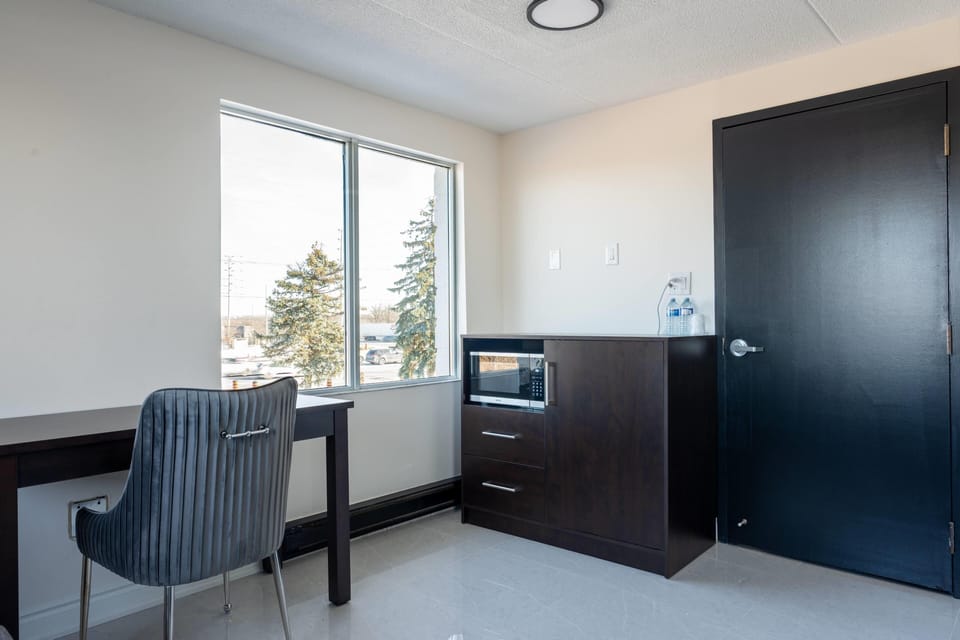 Suite, Multiple Beds, Non Smoking | Desk, blackout drapes, iron/ironing board, free WiFi