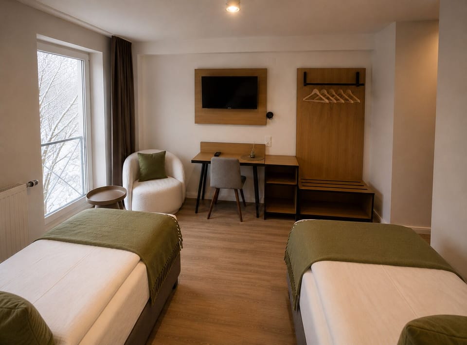 Twin Room | Living area | 40-inch Smart TV with cable channels, offices