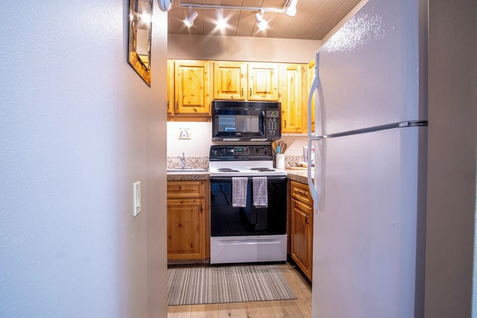 Condo, 2 Queen Beds, Patio, Mountain View (Wildwood Cottage at Villager) | Private kitchen | Dining tables