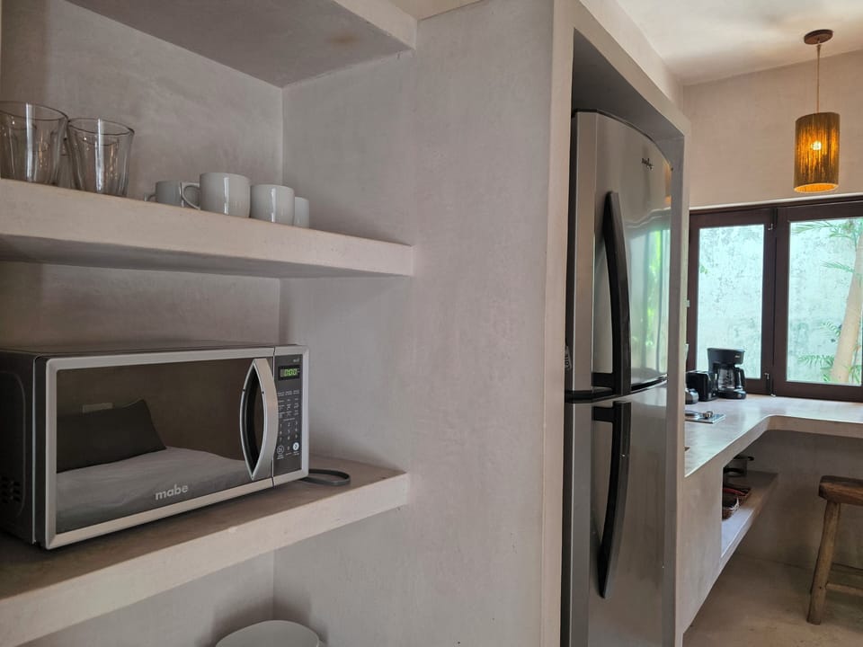 Full-size fridge, microwave, cookware/dishes/utensils